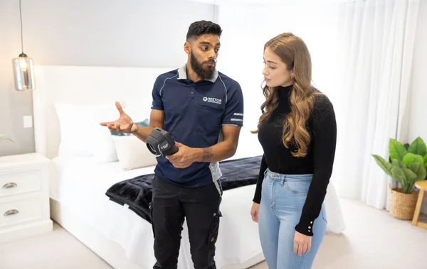 Reztor team member explaining an assessment to a customer